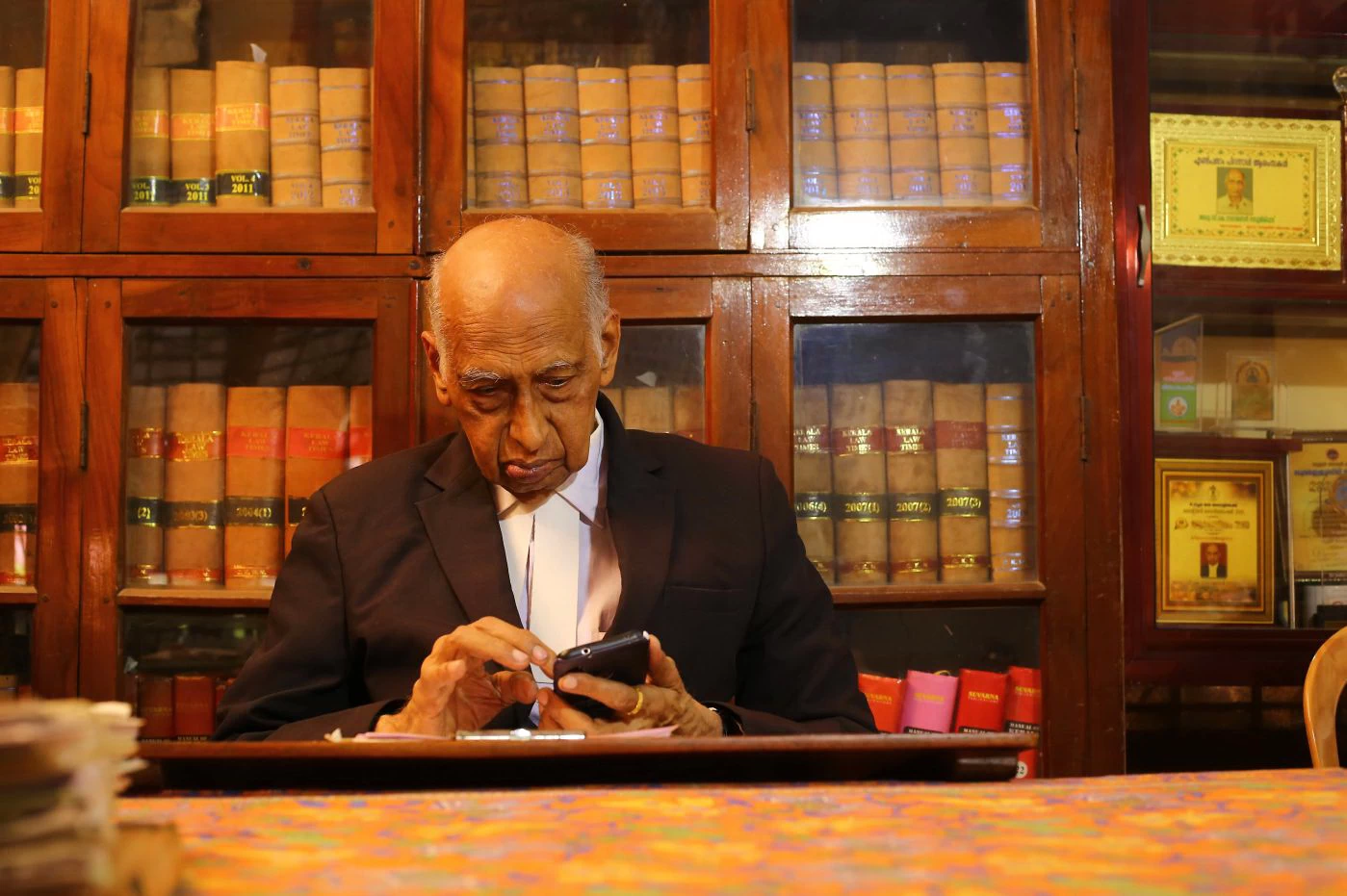 Adv. C.K. Narayanan Namboothirippad in office at Chittoor Mana, Ayyanthol